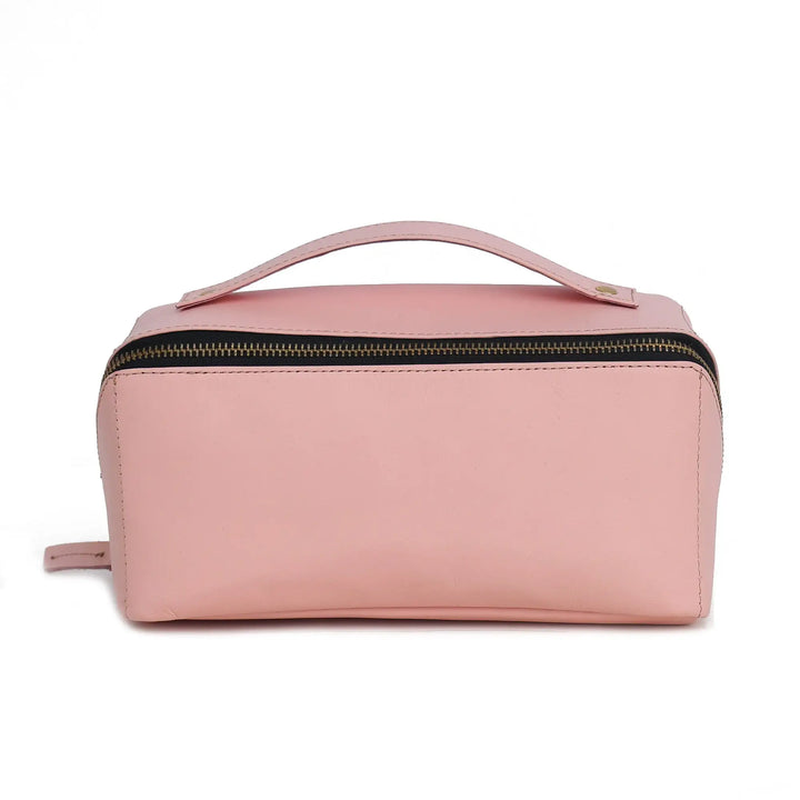 Pink toiletry bag with a handle on a white background