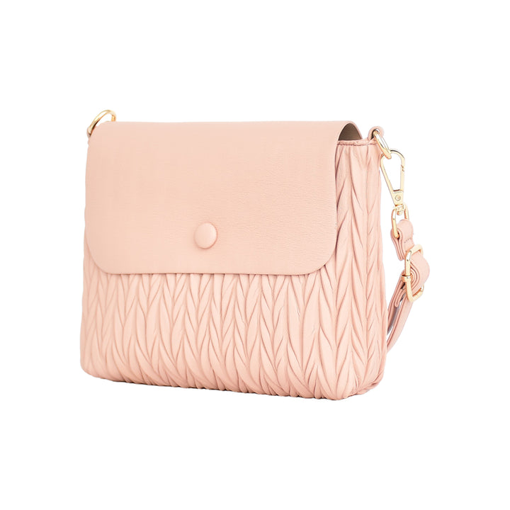 Pink crossbody bag with a textured pattern on a white background