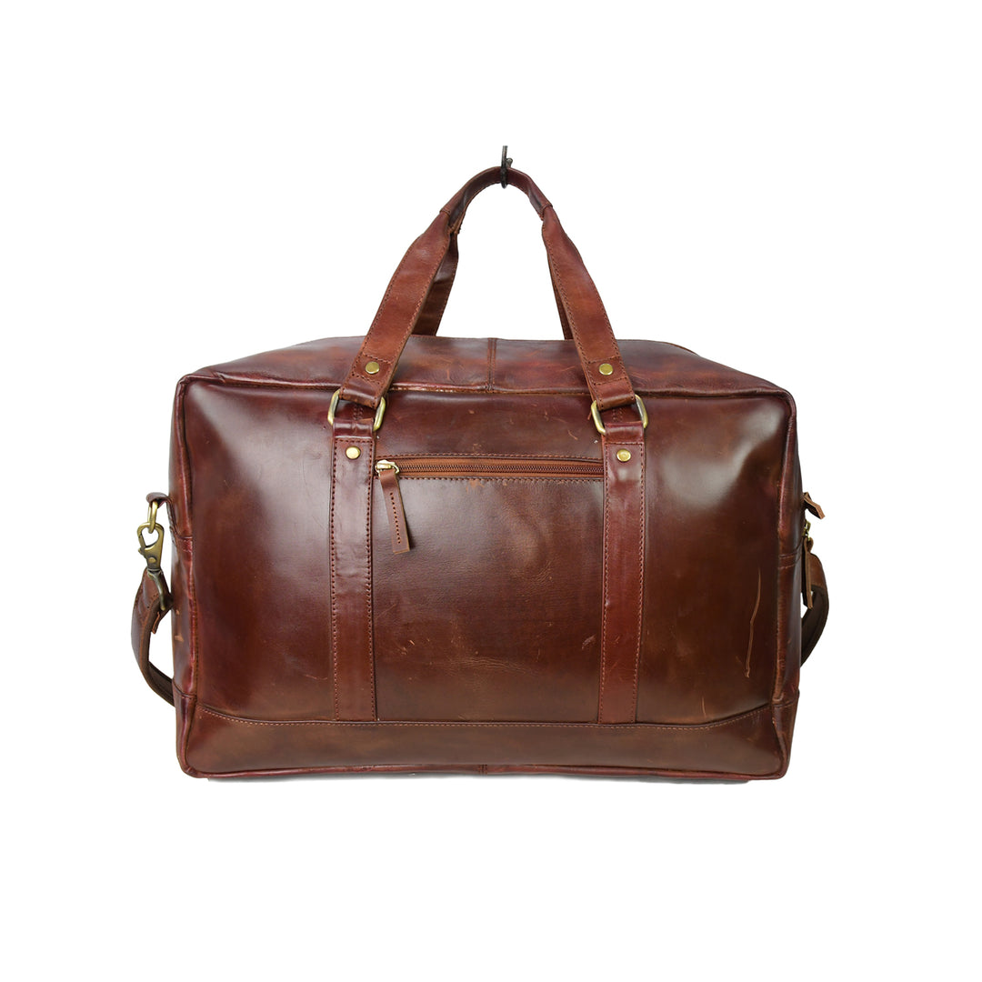 Brown leather duffel bag on a white background