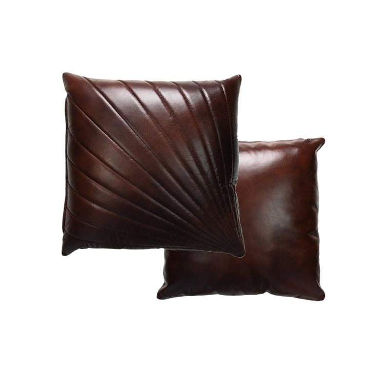 Two brown leather pillows on a white background