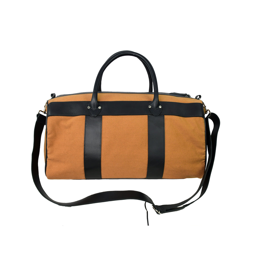 Brown duffel bag with black straps on a white background