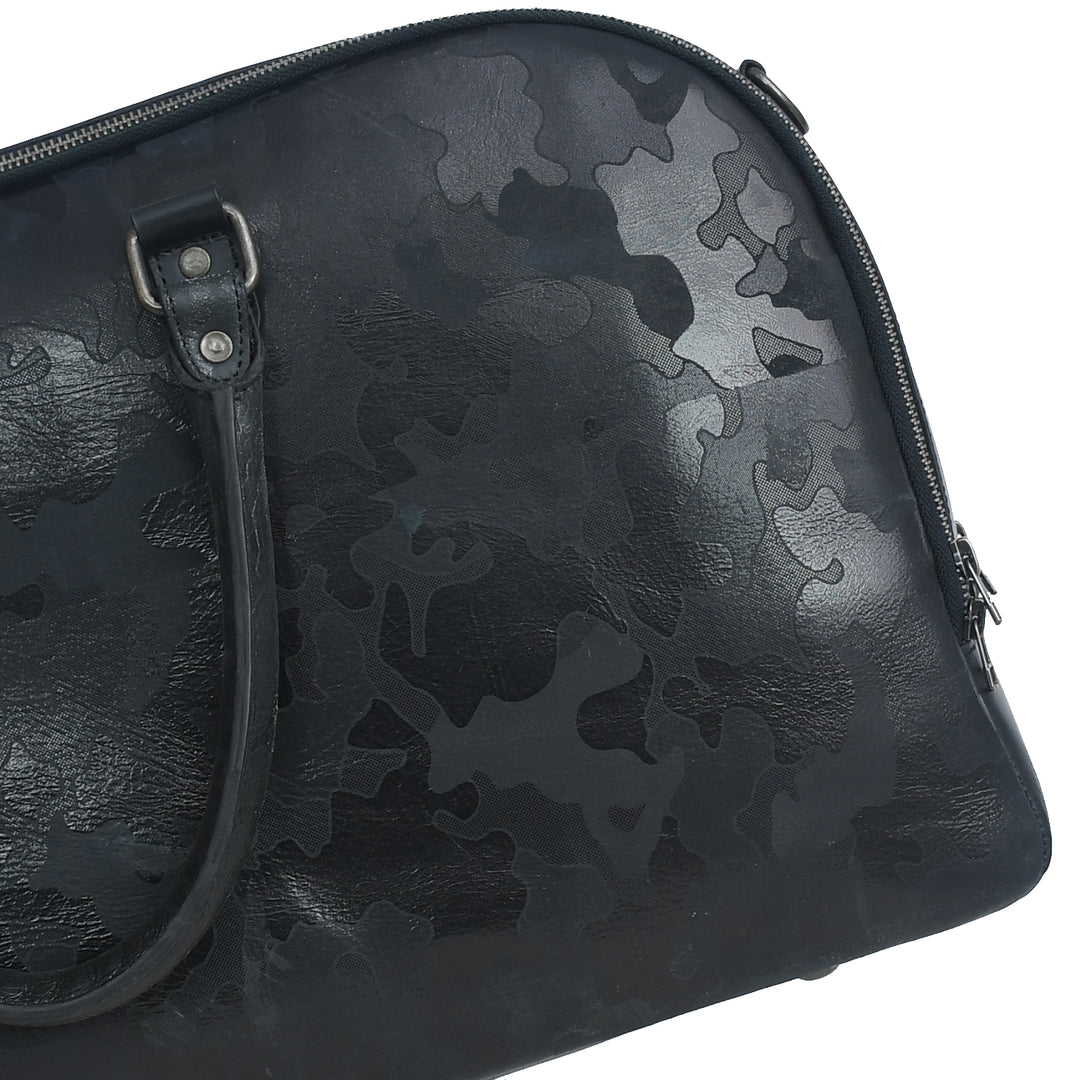 Black leather bag with camouflage pattern on a white background