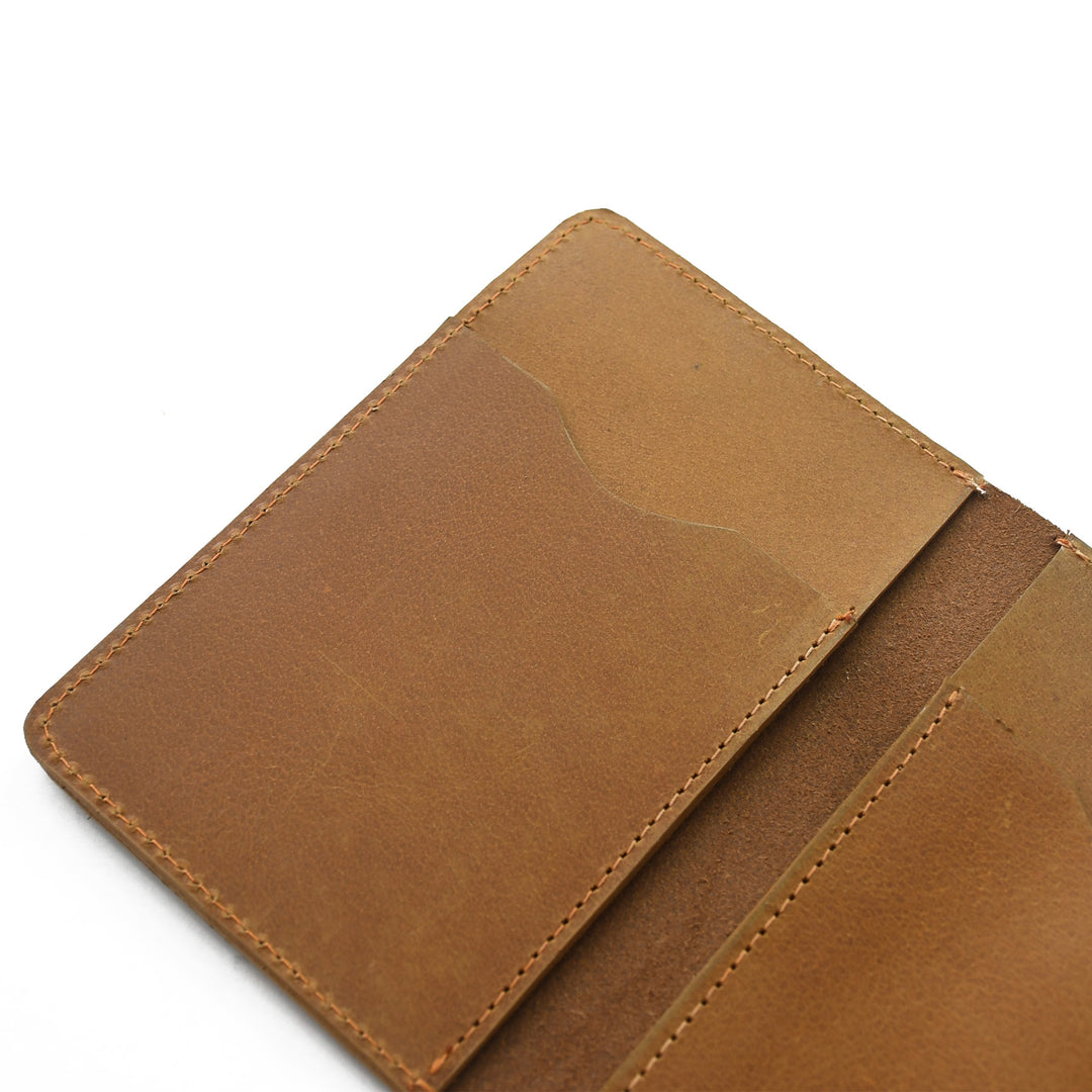 Close-up of a brown leather wallet on a white background