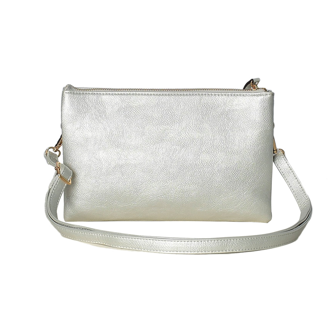 Silver metallic crossbody bag on a white background