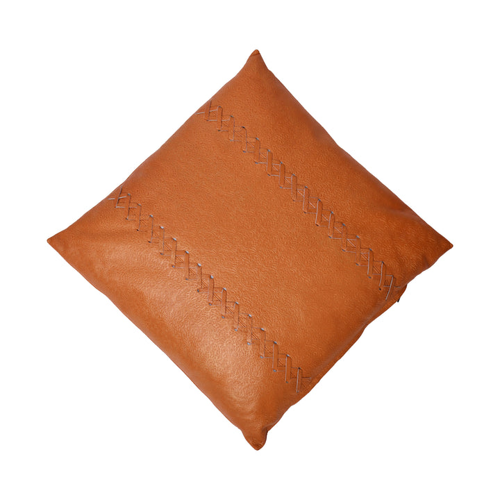 Brown leather pillow with decorative stitching on a white background

