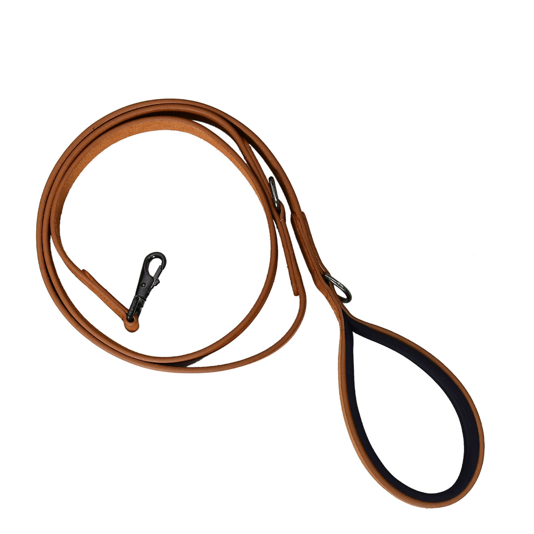 Brown leather dog leash with black plastic handle on a white background

